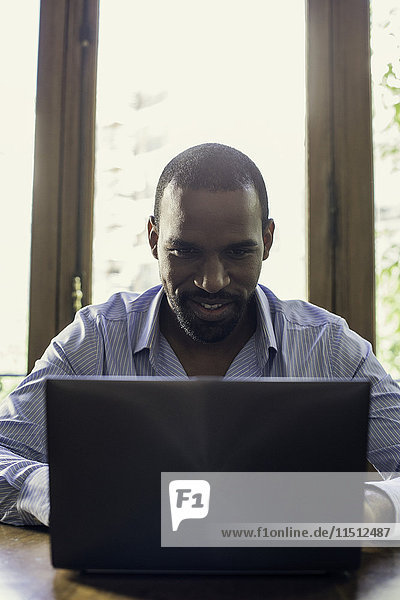 Man using laptop computer