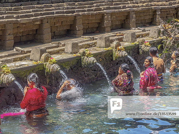 Bathing in the holy waters of Pura Tirta Empul  Bali  Indonesia  Southeast Asia  Asia