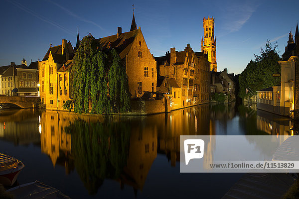 Evening reflections on Rozenhoedkaai  with Belfry (Belfort) Tower  UNESCO World Heritage Site  Bruges  West Flanders  Belgium  Europe