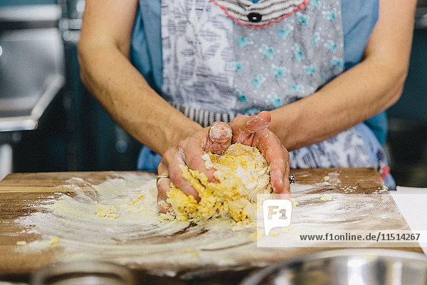 Woman kneading pasta dough