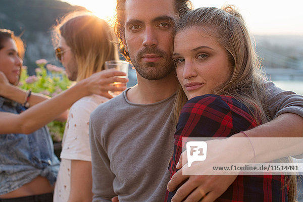 Portrait of couple at waterfront roof terrace party  Budapest  Hungary