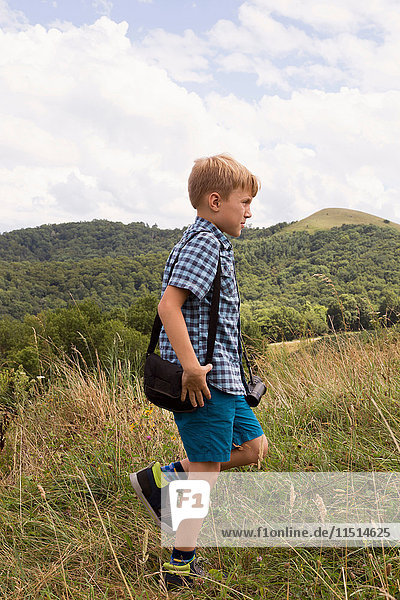 Young boy exploring outdoors