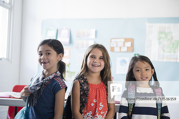 Portrait of girls smiling in classroom