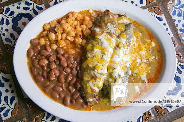 Enchiladas and beans in bowl