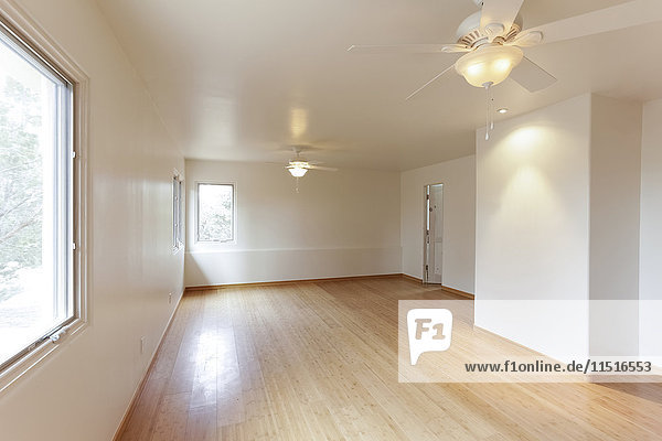Hardwood floor in empty white room