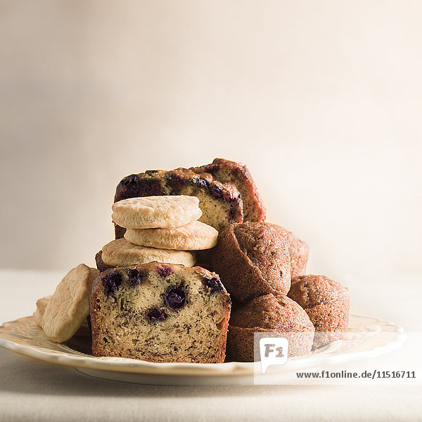 Pile of cookies and breakfast bread on plate