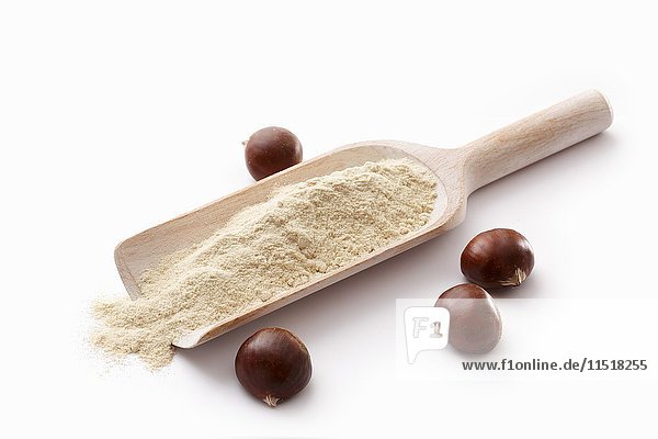 Chestnut flour on a wooden scoop