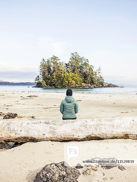 Woman looking out at island from Long Beach  Pacific Rim National Park  Vancouver Island  British Columbia  Canada