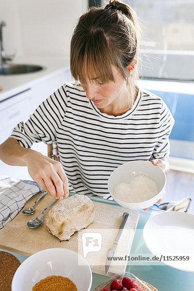 Young woman preparing vegan cake
