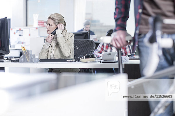 Woman on the phone in office