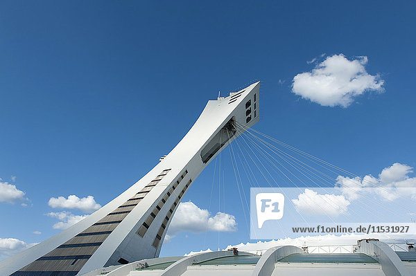 Canada. Province of Quebec. Montreal. District Hochelega-Maisonneuve (HoMa). The tower tilted and the ropes which hold the roof of the Olympic stadium (built for the Summer Olypics of 1976). Architect: Roger Taillibert (copyrights manager by ADAGP)