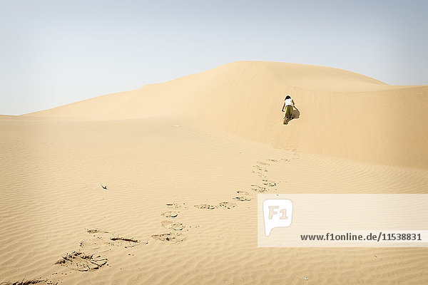 Man walking alone in the desert