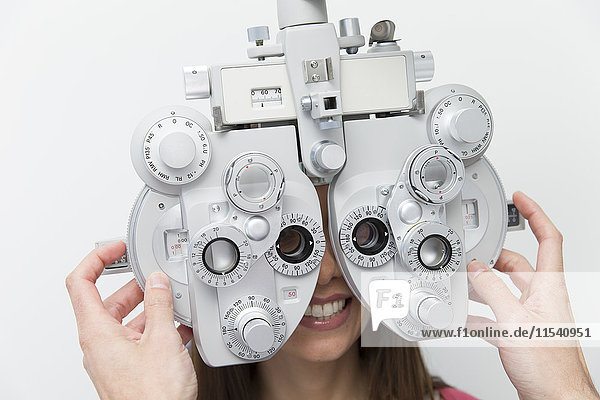 Woman at the optometrist making an eye test