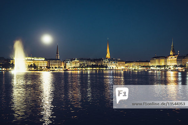 Germany  Hamburg  Skyline  full moon and Inner Alster Lake at night