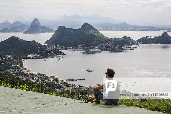 Brazil  Rio de Janeiro  tourist sitting at view point