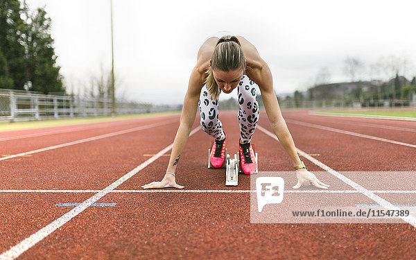 Athlete woman on a running track
