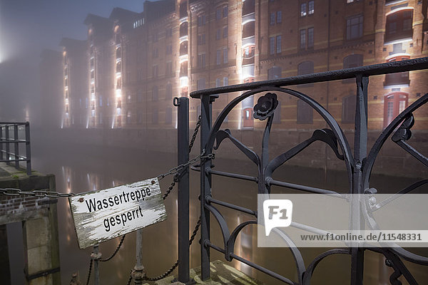 Germany  Hamburg  Closed stairway in the Historic Warehouse district Speicherstadt in fog at night