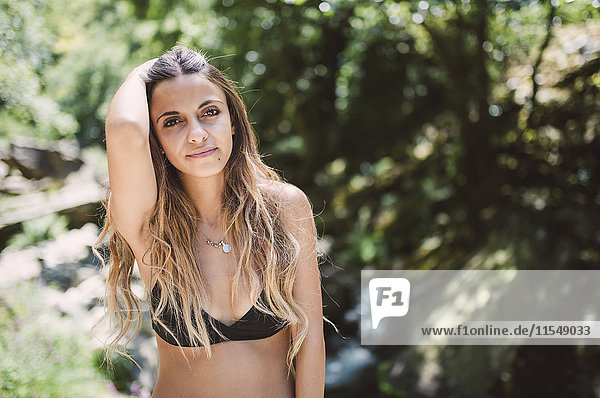 Portrait of young woman wearing bikini top