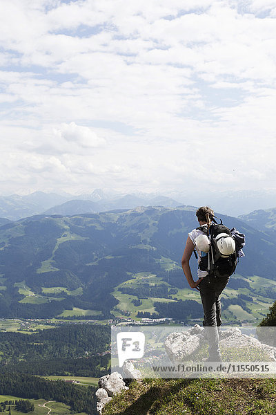 Austria  Tyrol  Wilder Kaiser  man looking into the valley towards Ellmau