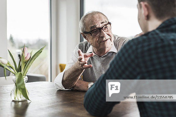 Portrait of senior man communicating with his grandson