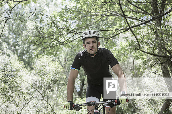 Man on mountainbike in forest