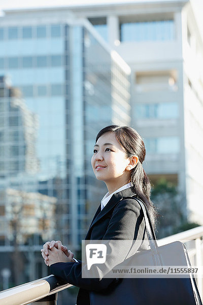 Japanese young businesswoman downtown Tokyo