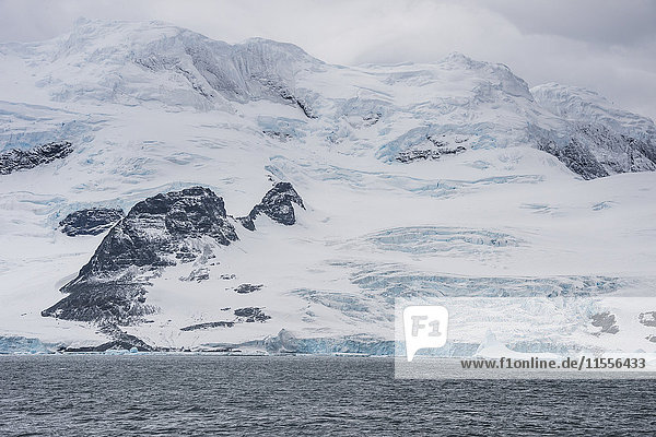 Glacier hanging on the rocks of Coronation Island  South Orkney Islands  Antarctica  Polar Regions