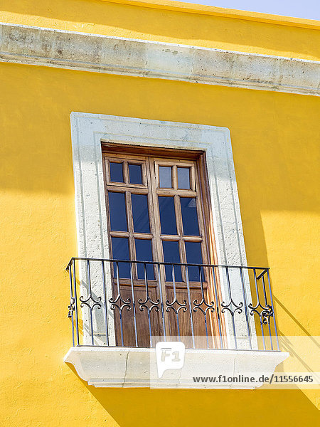 White window of yellow house  Oaxaca  Mexico  North America
