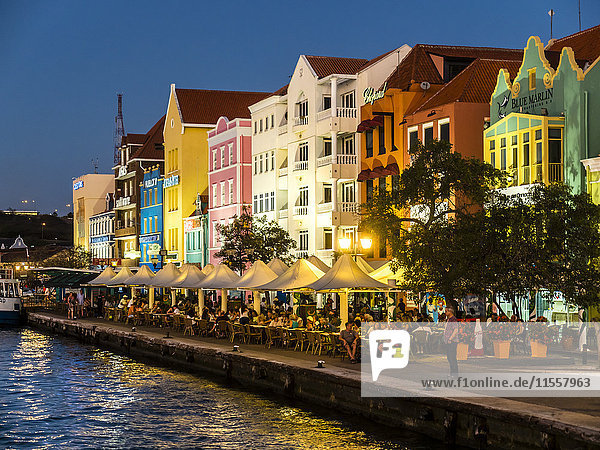 Curacao  Willemstad  Punda  colorful houses at waterfront promenade in the evening