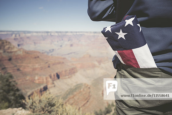 USA  Grand Canyon  man with American Flag in his pocket  partial view