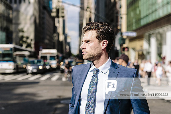 Handsome businessman walking in Manhattan