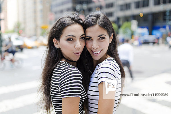 USA  New York City  portrait of two beautiful twin sisters in Manhattan