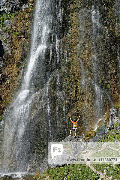 Austria  Tyrol  Rofan Mountains  hiker at Dalfaz waterfall