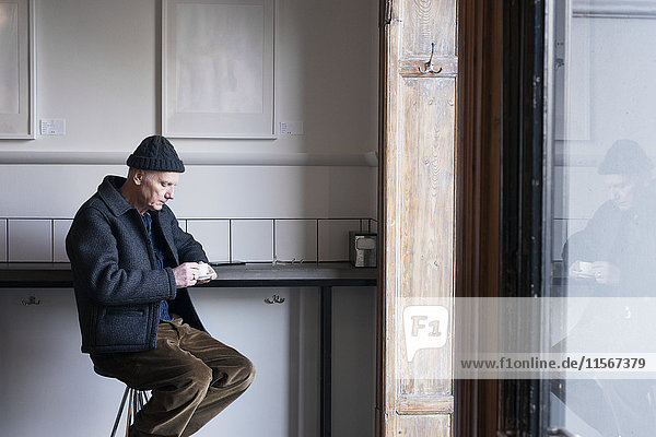 Senior man in cafe