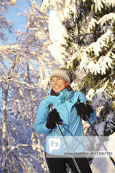 Woman skiing in scenics forest