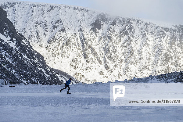 Person skiing on frozen lake