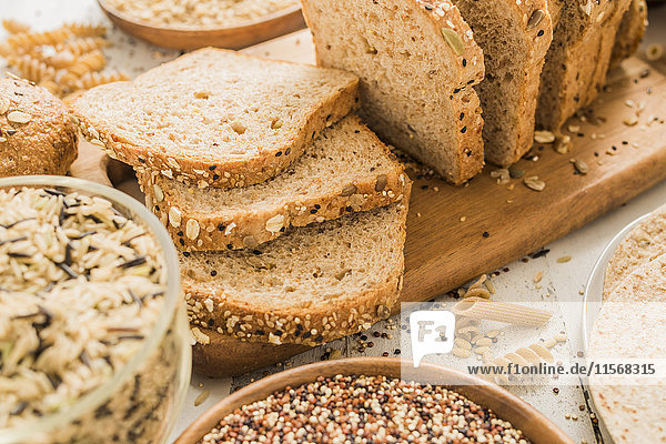 Sliced brown bread on cutting board