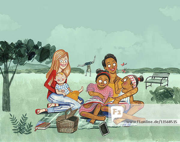 Zwei Mütter spielen mit ihren Kindern auf einer Picknickdecke auf dem Land