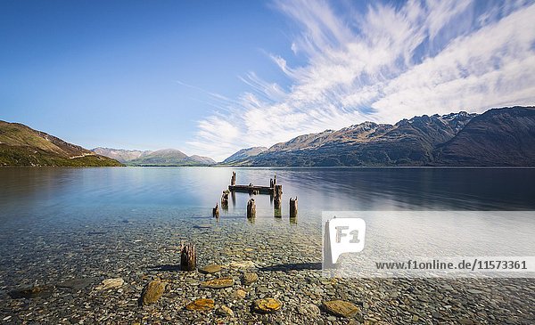 Decayed jetty  old wooden posts in Lake Wakatipu at Glenorchy  Otago Region  Southland  New Zealand  Oceania