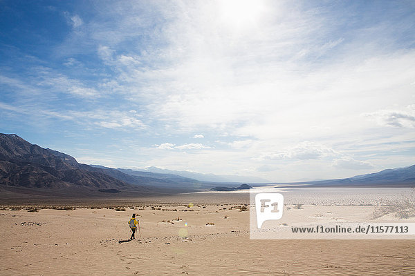 Trekker walking in Death Valley National Park  California  US