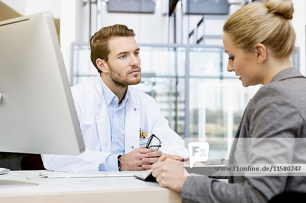 Doctor in meeting with consultant