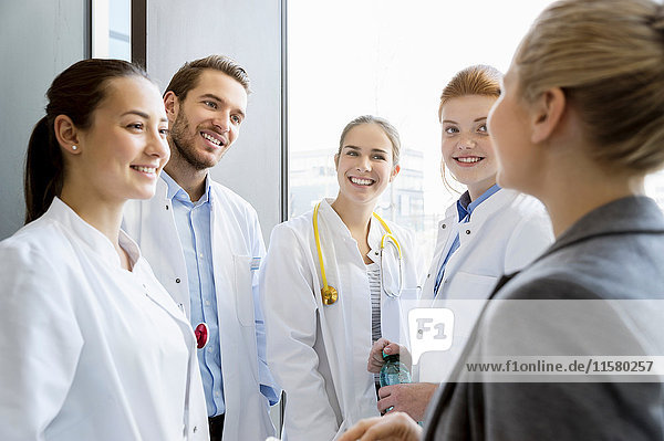 Group of doctors having discussion with consultant
