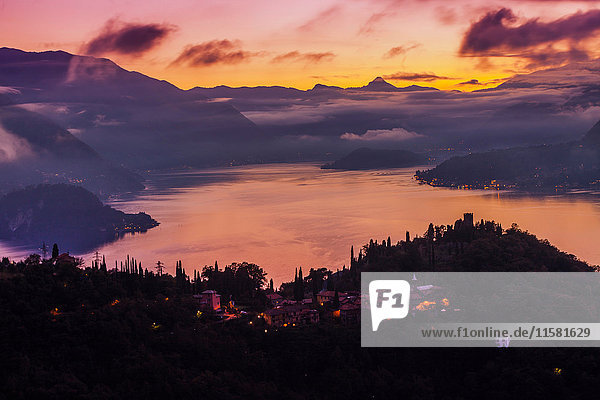 Cloud covered mountains across Lake Como at sunset  Varenna  Italy
