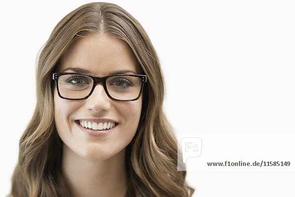 Mid adult woman wearing glasses  studio shot.