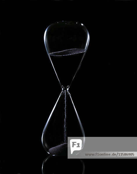 Hour glass on black background