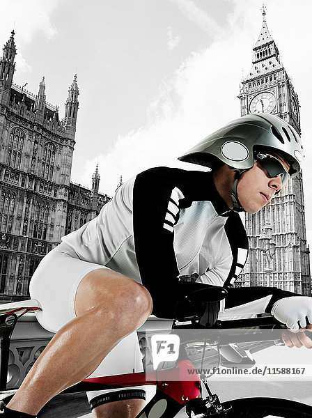 Cyclist with Houses of Parliament in background  London  England