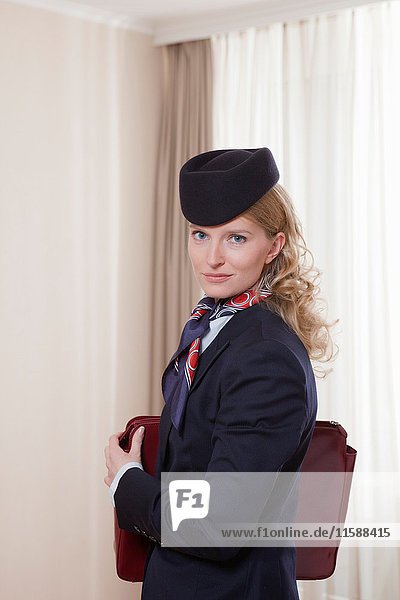 stewardess in hotel room