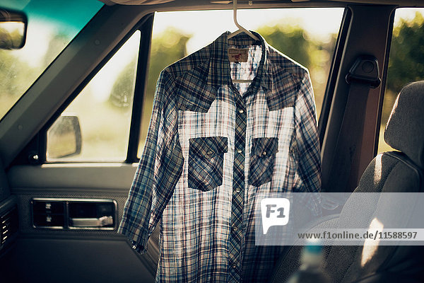 Checkered shirt in a car
