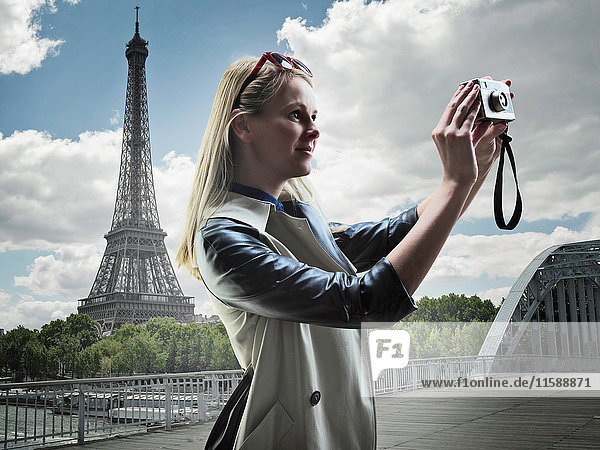Woman taking pictures in Paris
