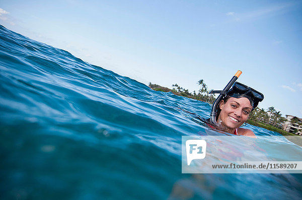 Woman snorkeling in tropical ocean